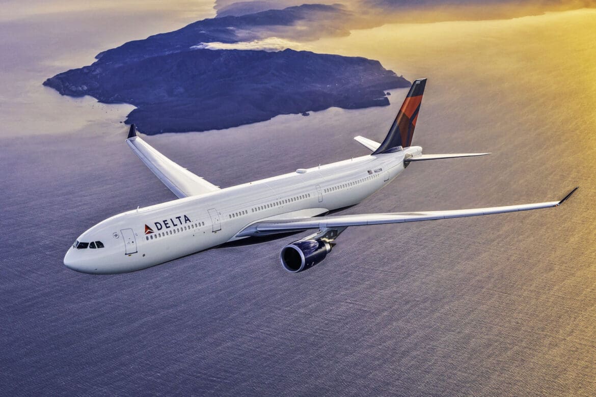 delta-a330-300 an airplane flying over water