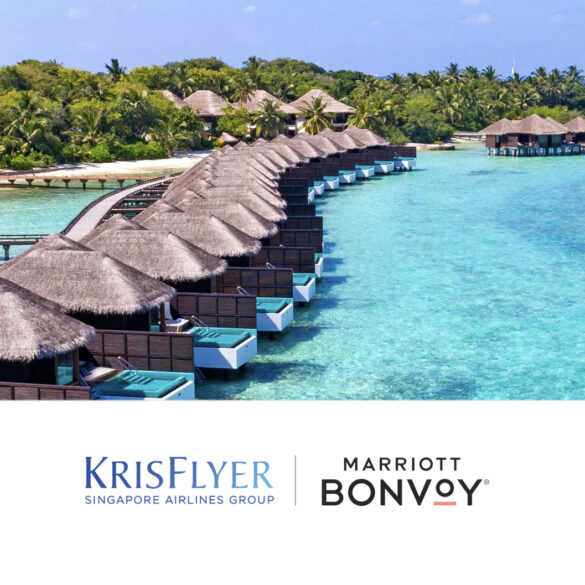 a group of huts on a dock over water