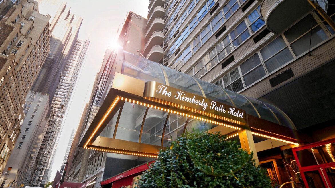 a hotel entrance with a glass roof