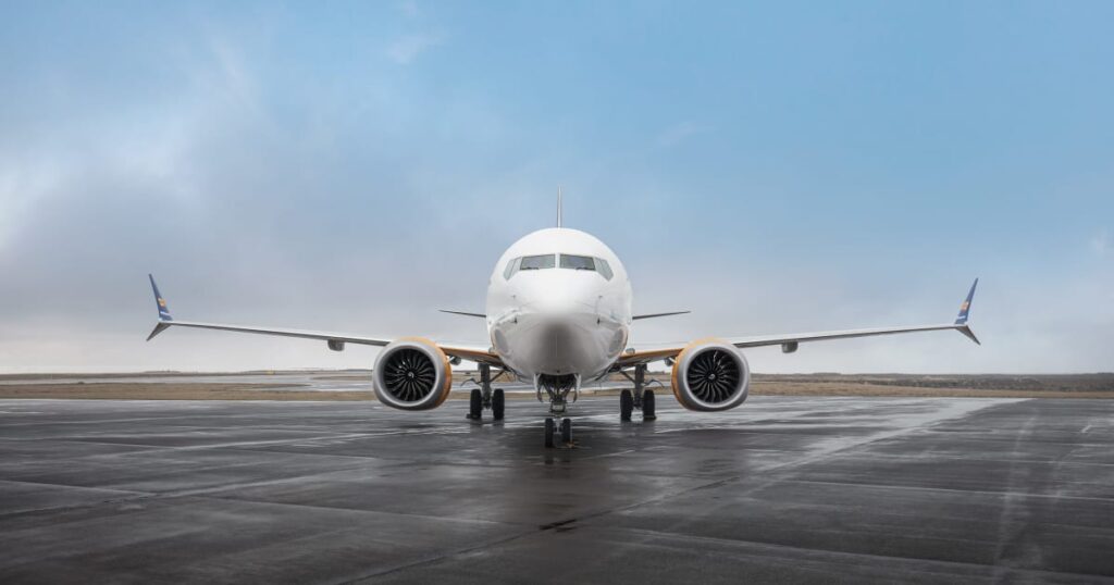 a white airplane on a runway