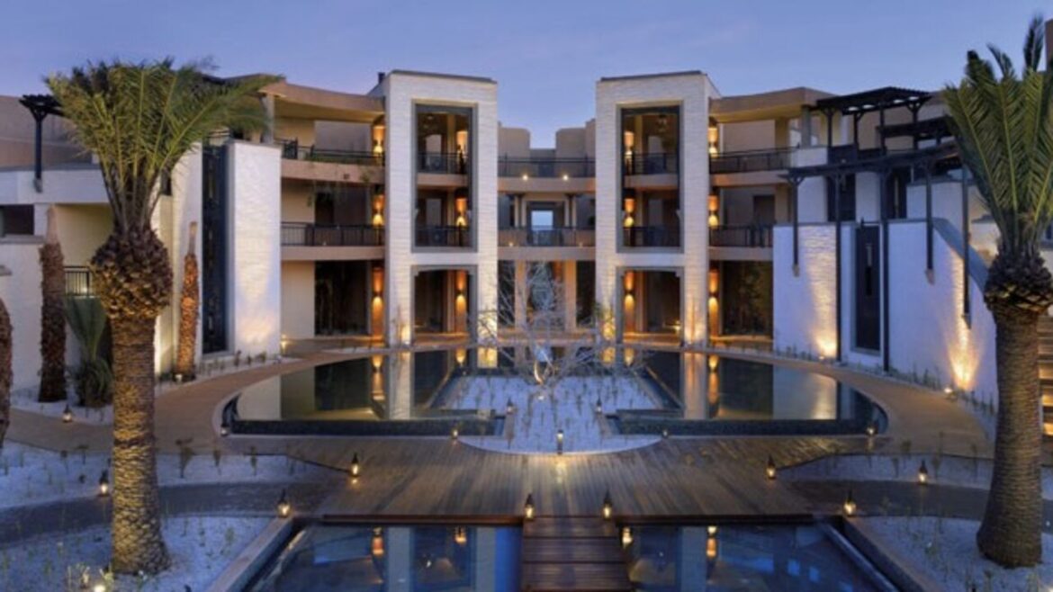 a building with a pool and a tree