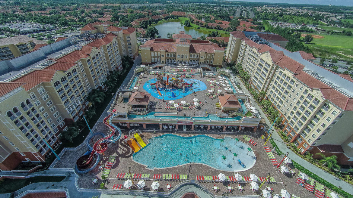 a swimming pool and water slide in a resort