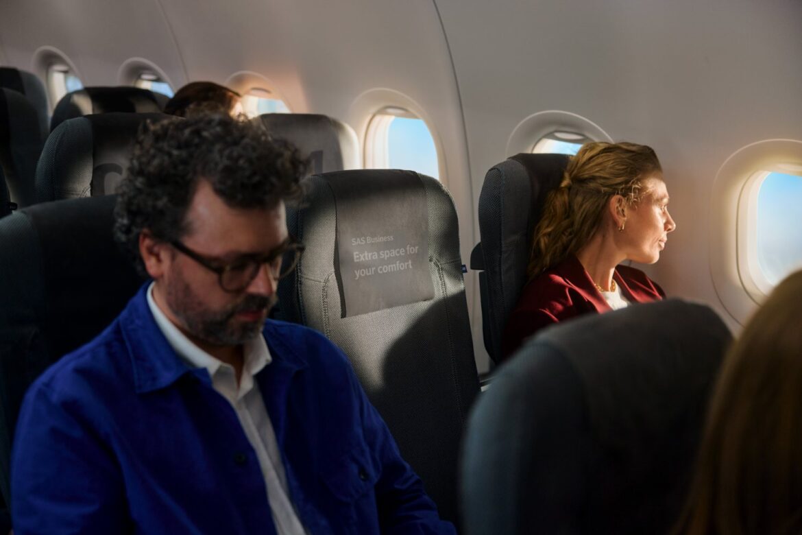SAS Business Class 2 people sitting in an airplane