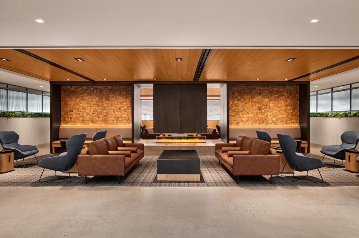 a room with a fireplace and couches