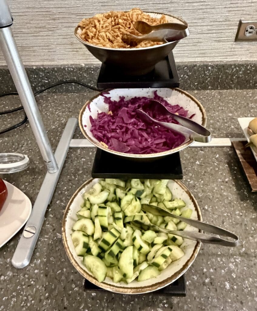 a row of bowls of food