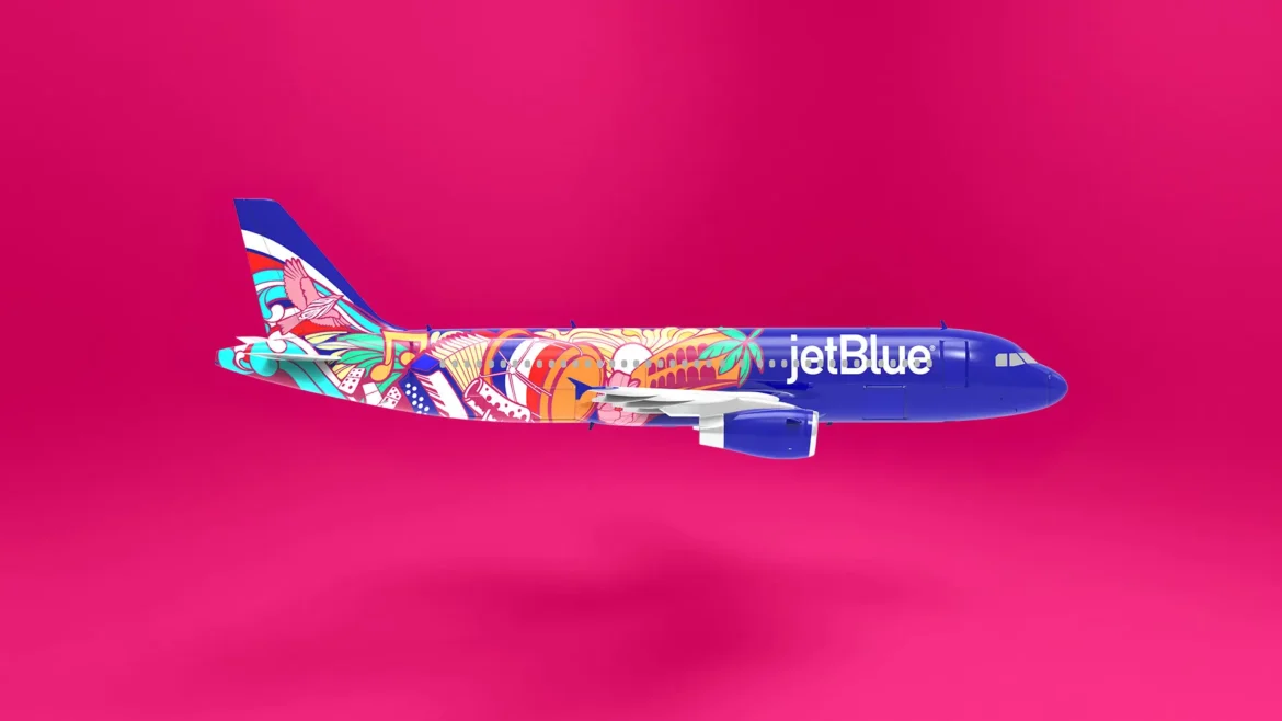 a blue and white airplane with colorful designs